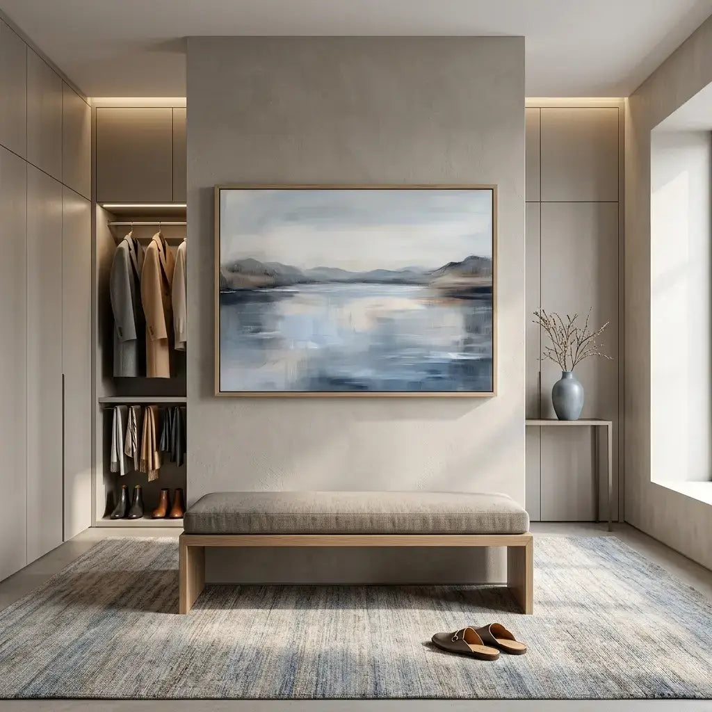 Modern interior with a bench, rug, and wall art in a neutral color scheme.