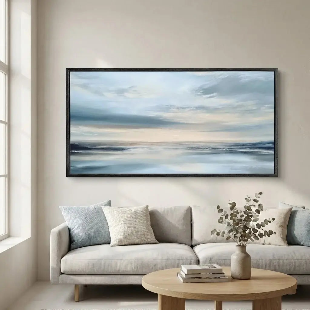 Framed abstract artwork above a sofa in a living room