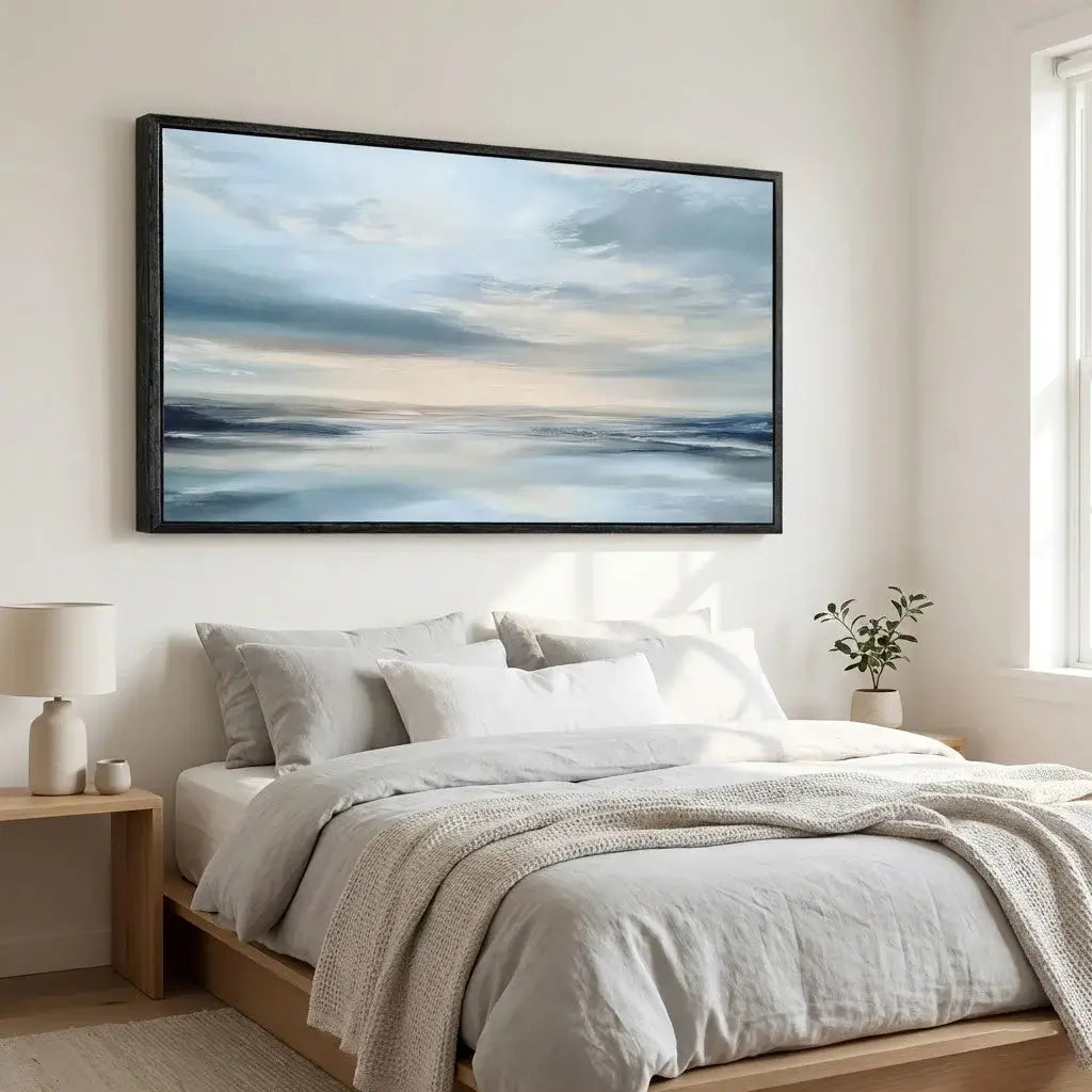 Bedroom with a large framed abstract painting above the bed