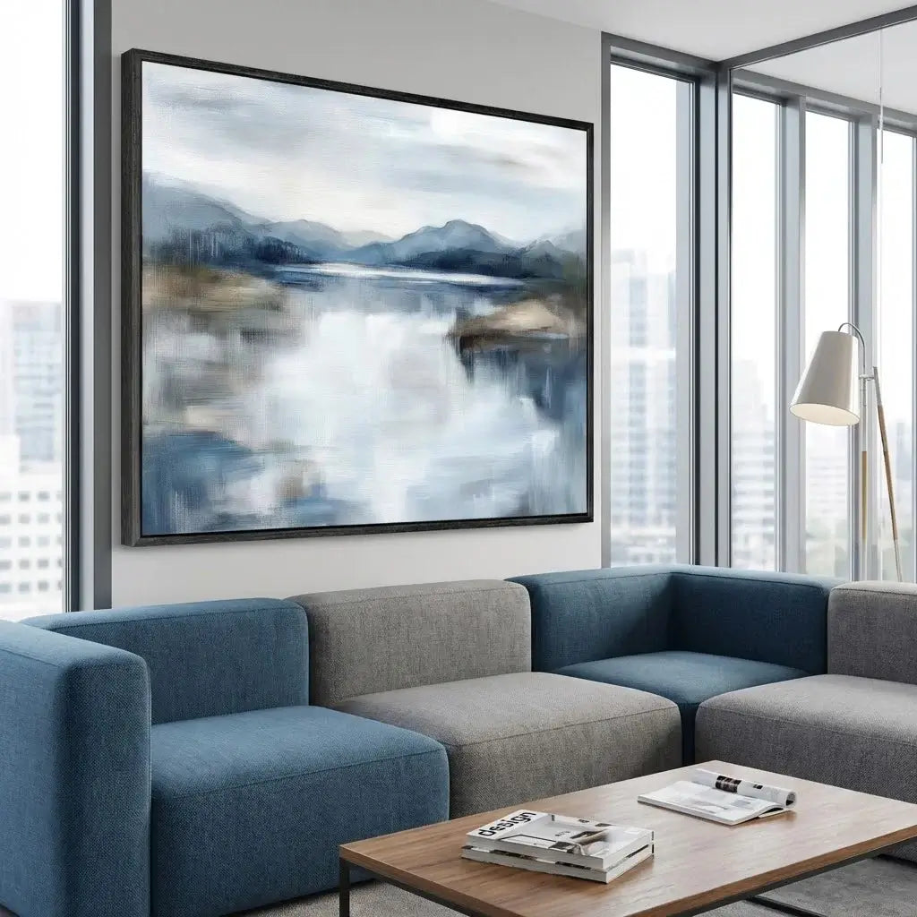 Modern living room with a blue and gray sofa, wooden coffee table, and a large abstract painting on the wall.