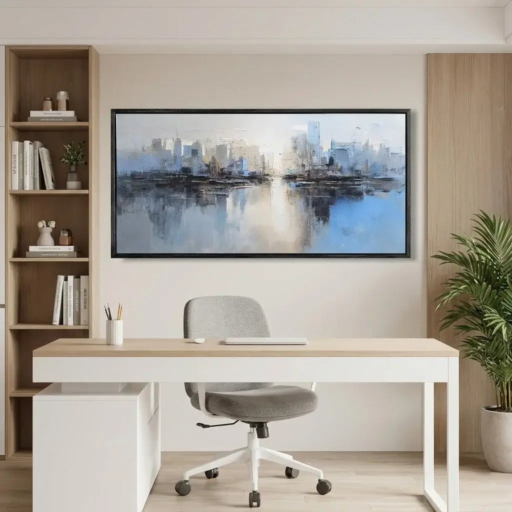 Modern office setup with a desk, chair, bookshelf, and wall art.