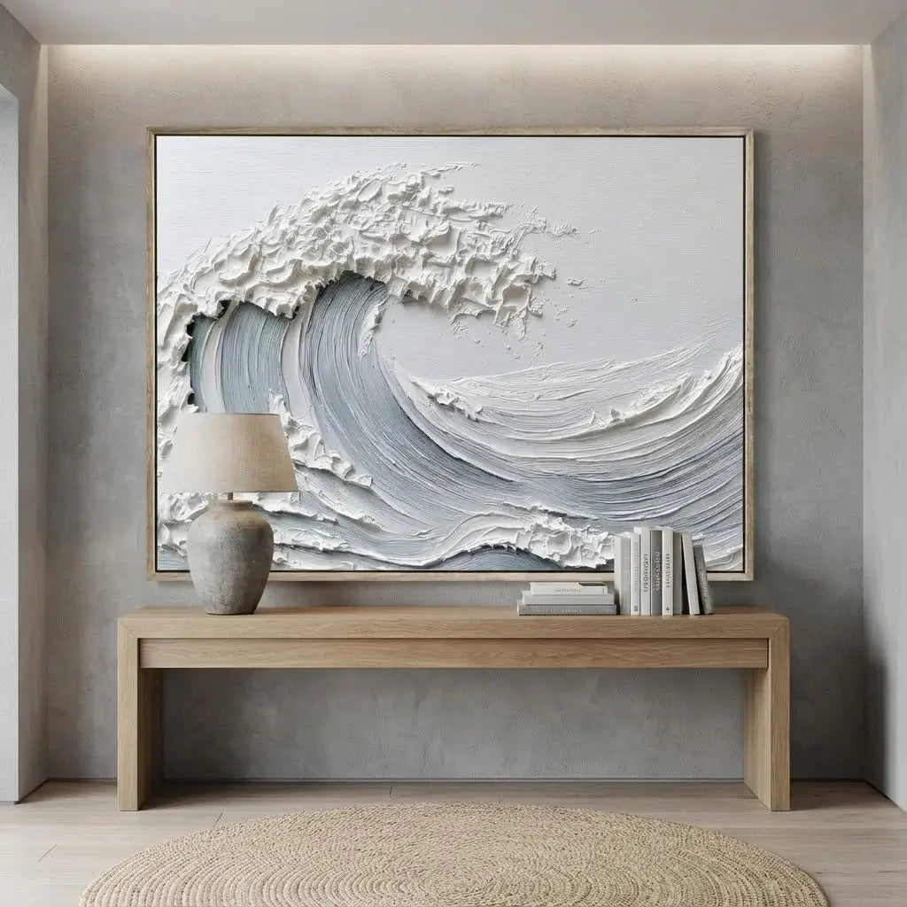 Modern interior with a large abstract wave painting above a wooden console table.