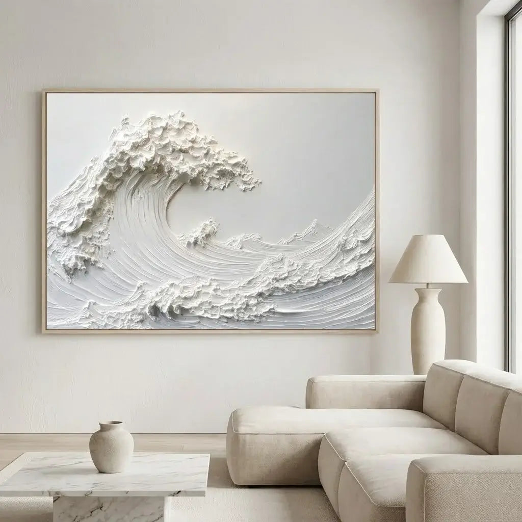 Living room with a large abstract wave painting on the wall, a beige sofa, and a lamp.