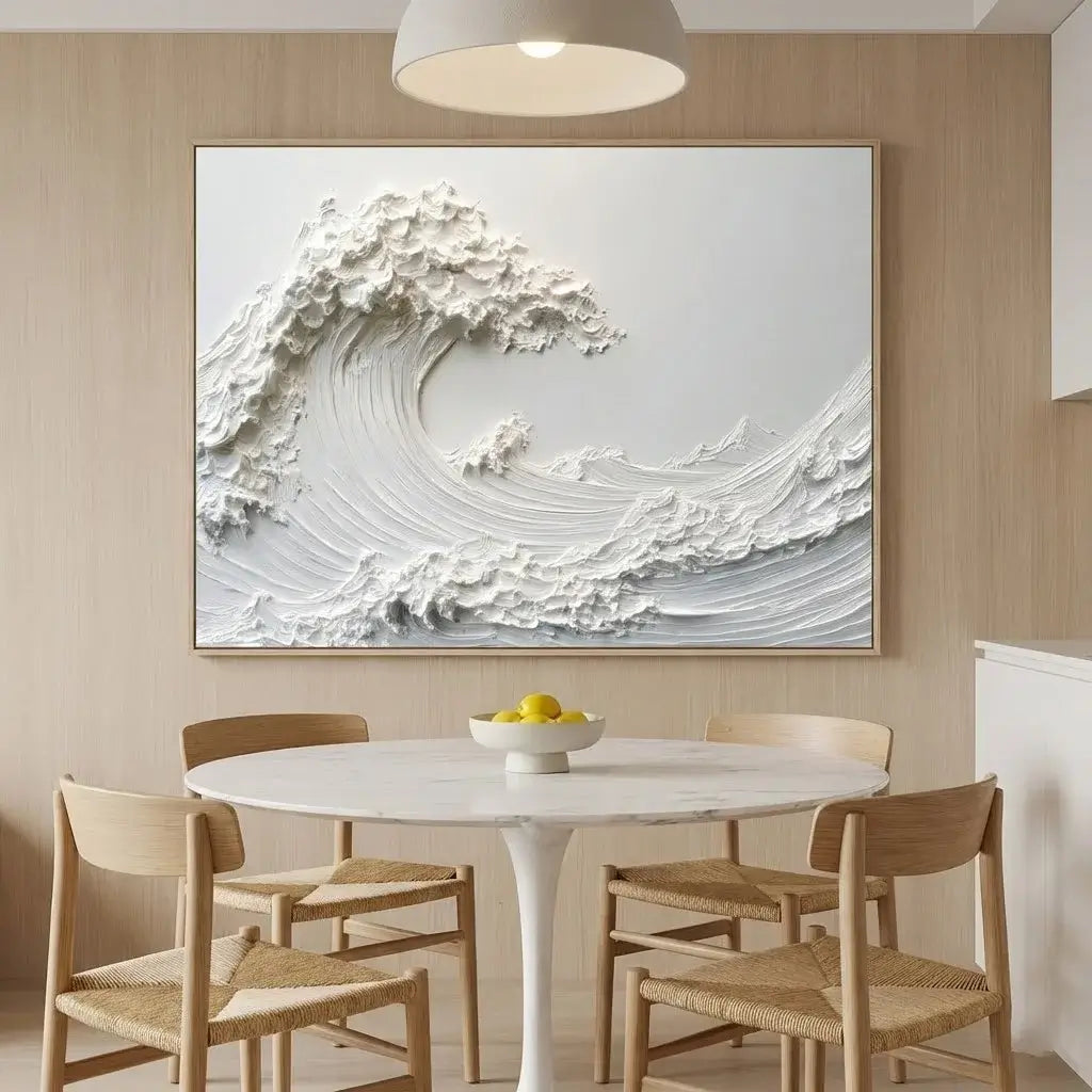 Dining room with a large abstract wave painting on the wall above a round table with chairs.