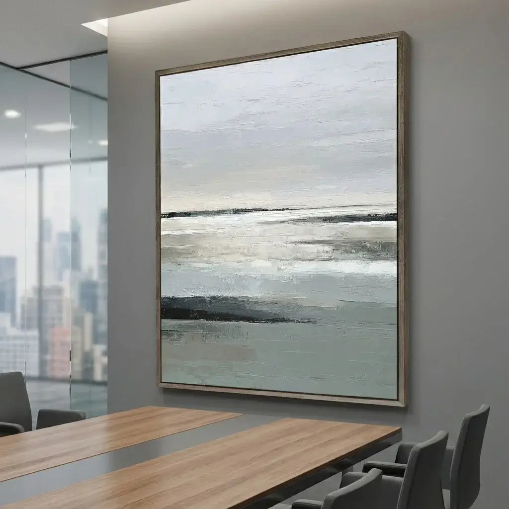 Abstract painting in a modern office setting with a conference table and chairs.
