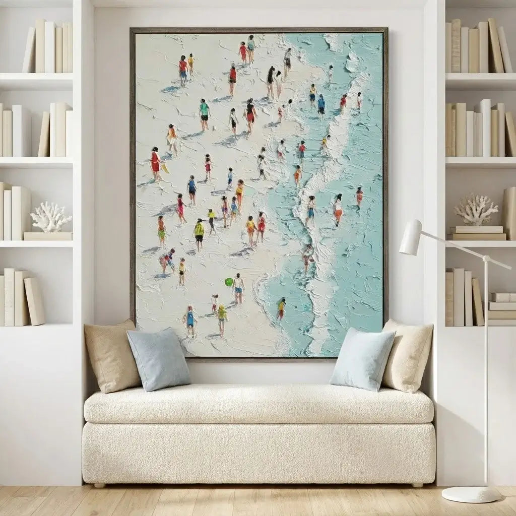 Beach scene painting on a wall above a sofa with decorative pillows