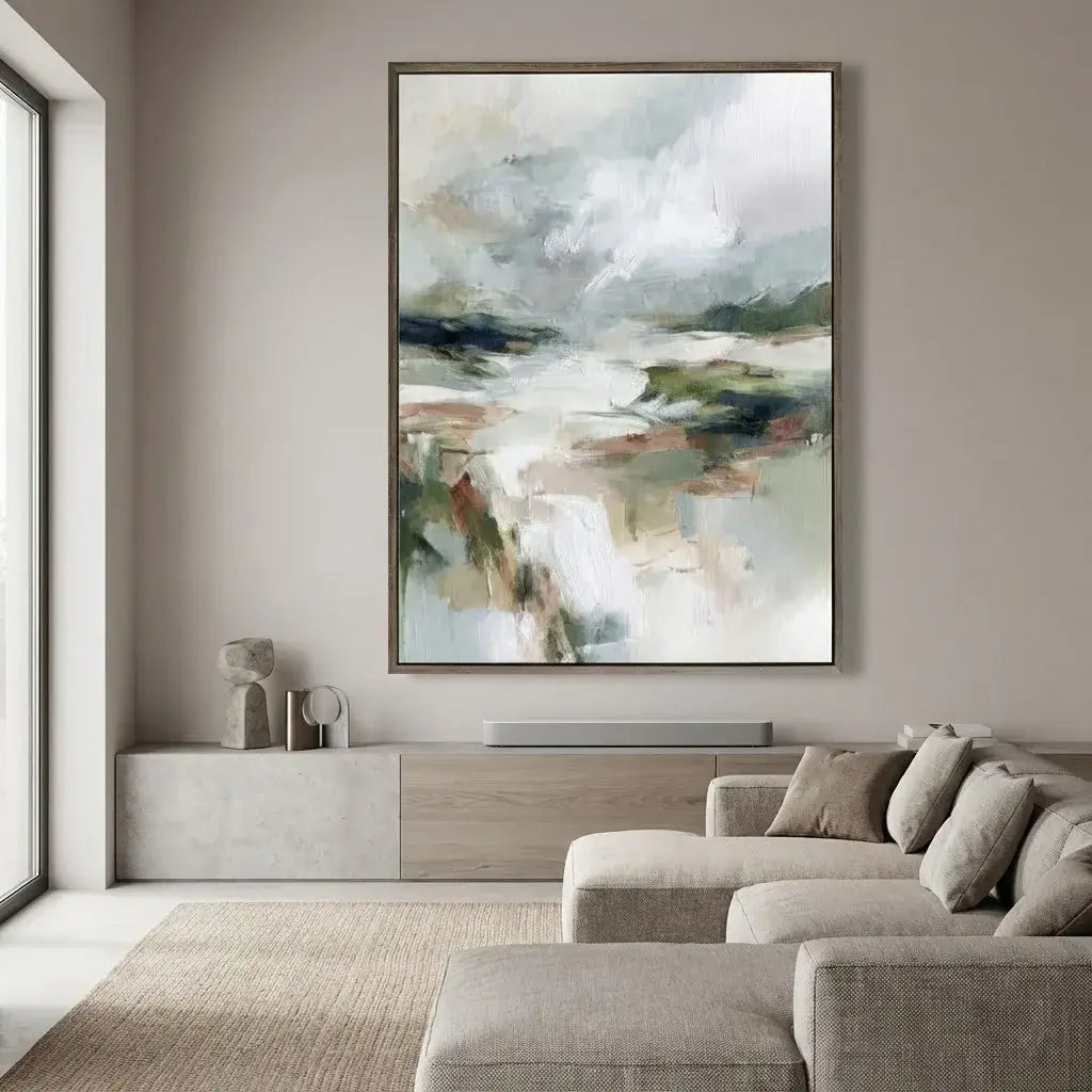 Abstract painting in a modern living room with a sofa and window.