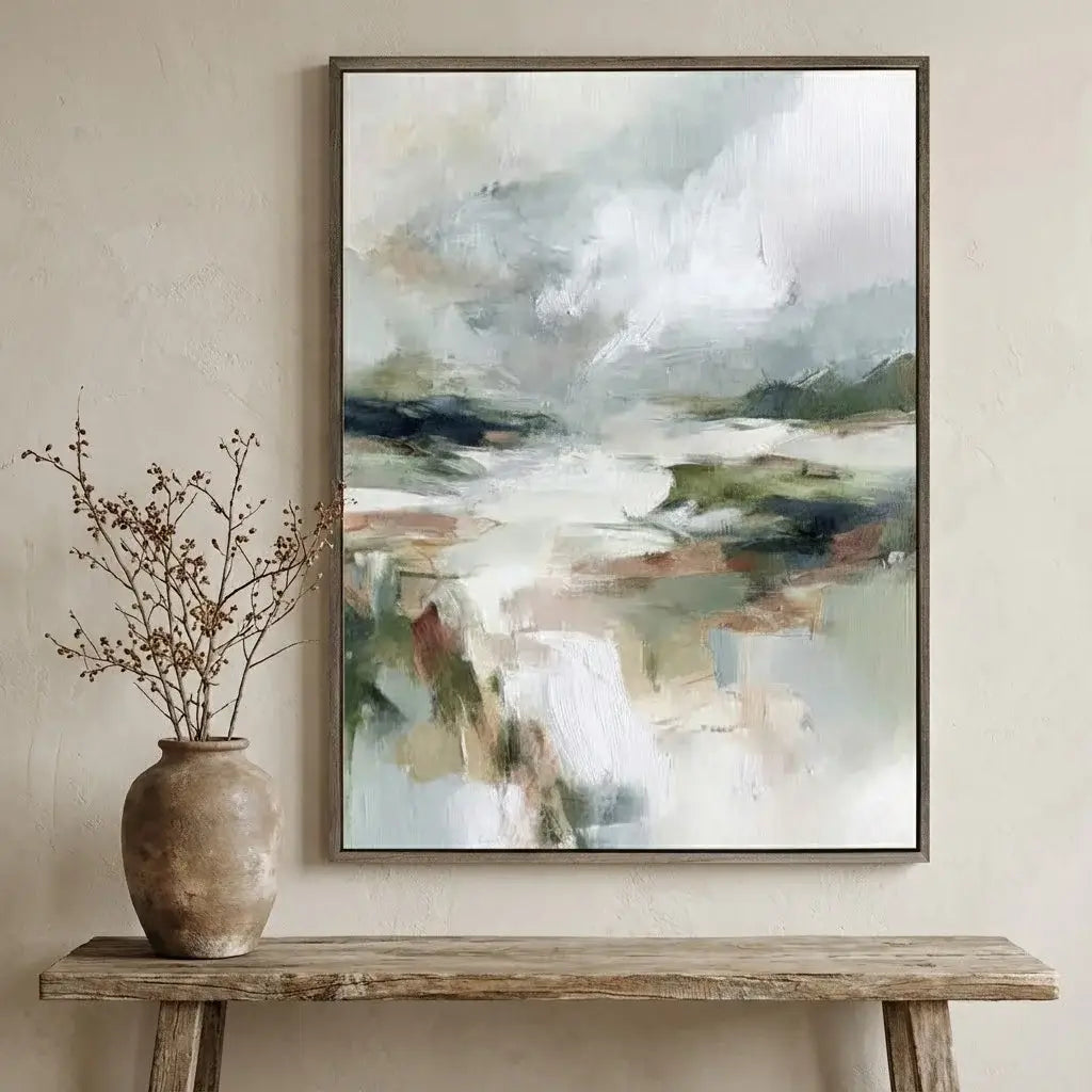 Abstract painting on a wall above a wooden console table with a vase.