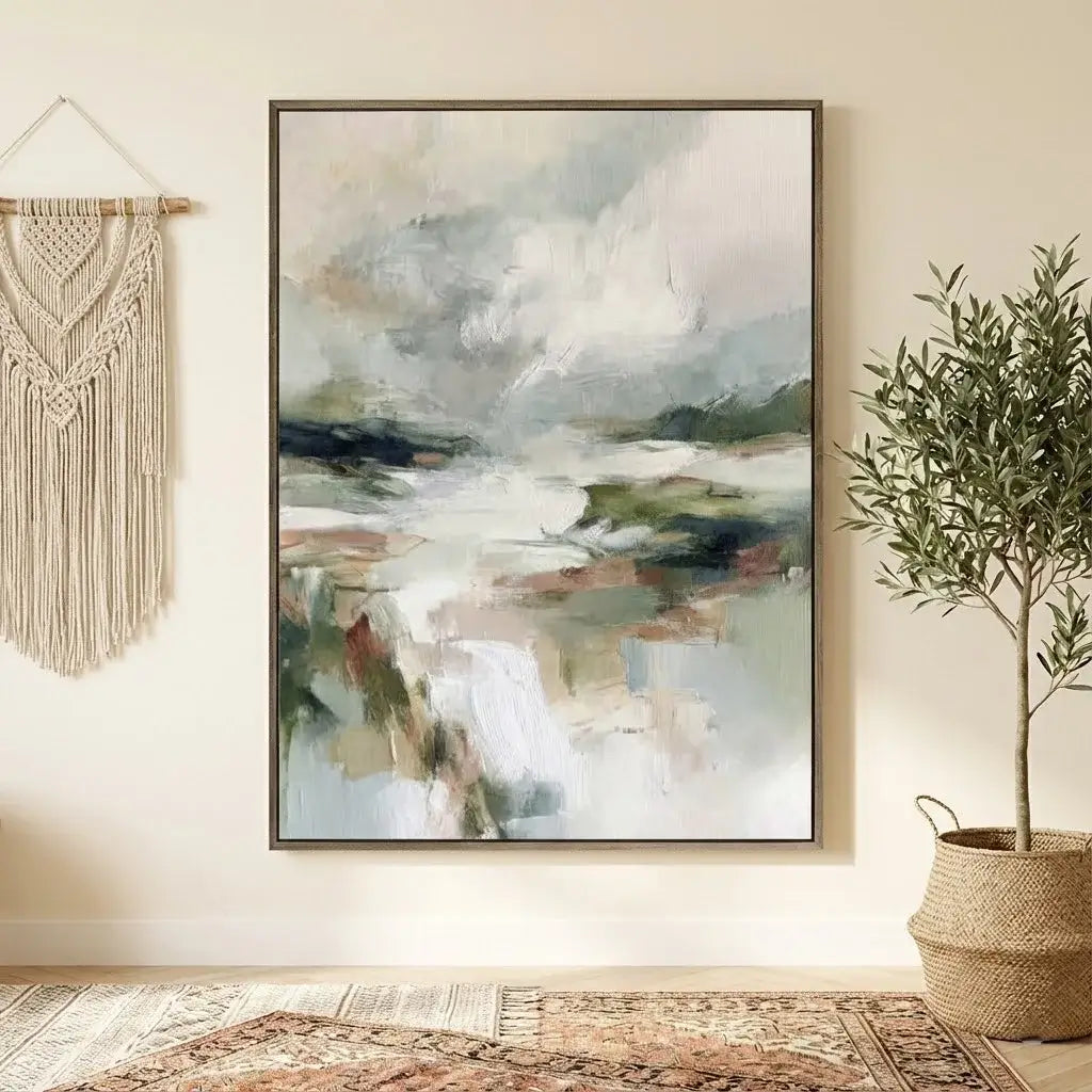 Abstract painting on a wall with a macrame hanging and plant in the corner.