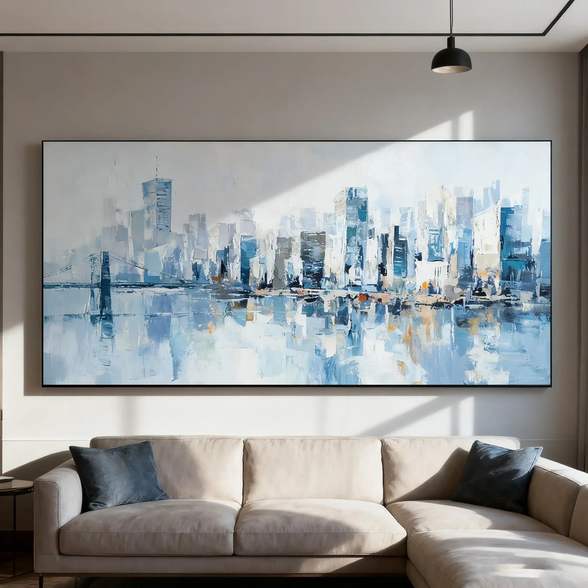 Large abstract cityscape painting on a wall above a beige sofa.