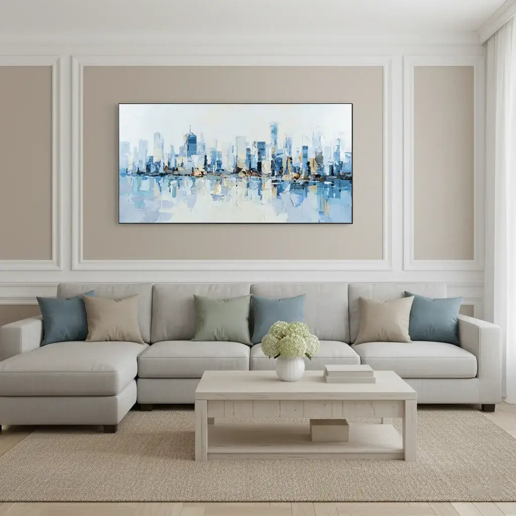 Modern living room with a sectional sofa, coffee table, and wall art of a city skyline.
