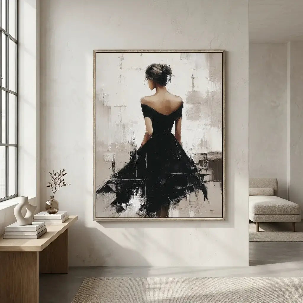 Framed artwork of a woman in a black dress on a wall in a modern room.