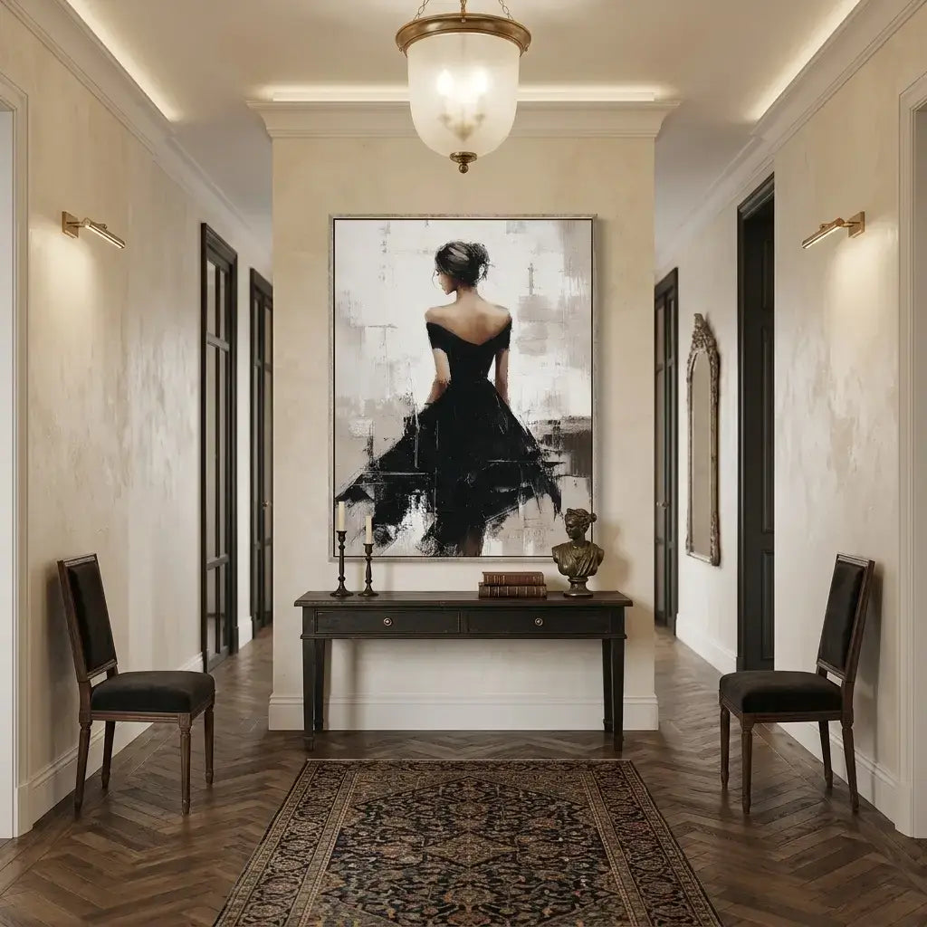 Elegant hallway with a large framed artwork of a woman in a black dress, two chairs, and a console table.