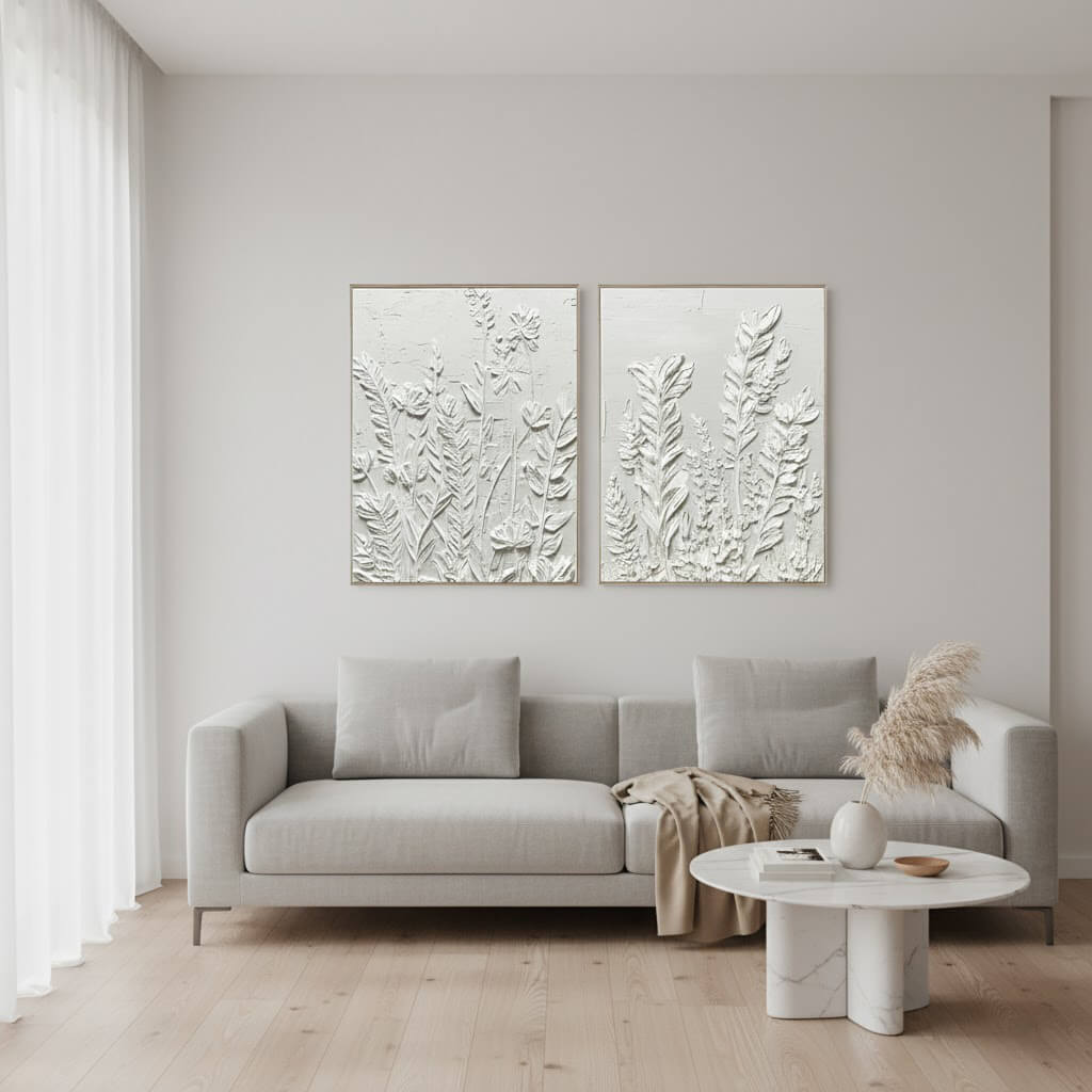 Modern living room with a gray sofa, decorative table, and wall art.