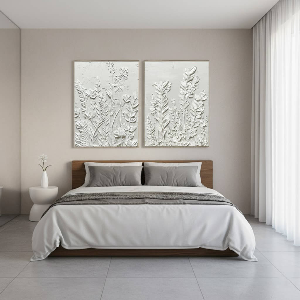 Modern bedroom with a bed, side table, and wall art