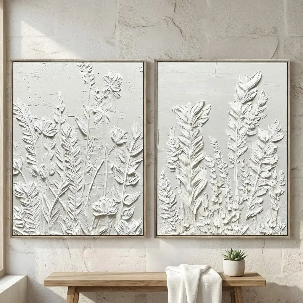Two framed botanical wall art pieces on a neutral wall.