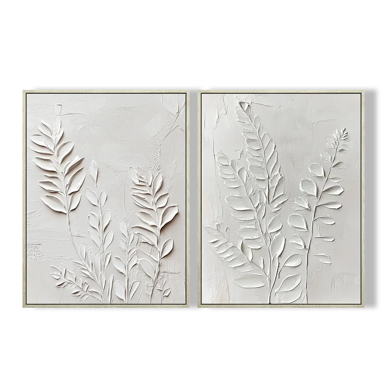 Two framed wall art pieces with leaf patterns on a white background