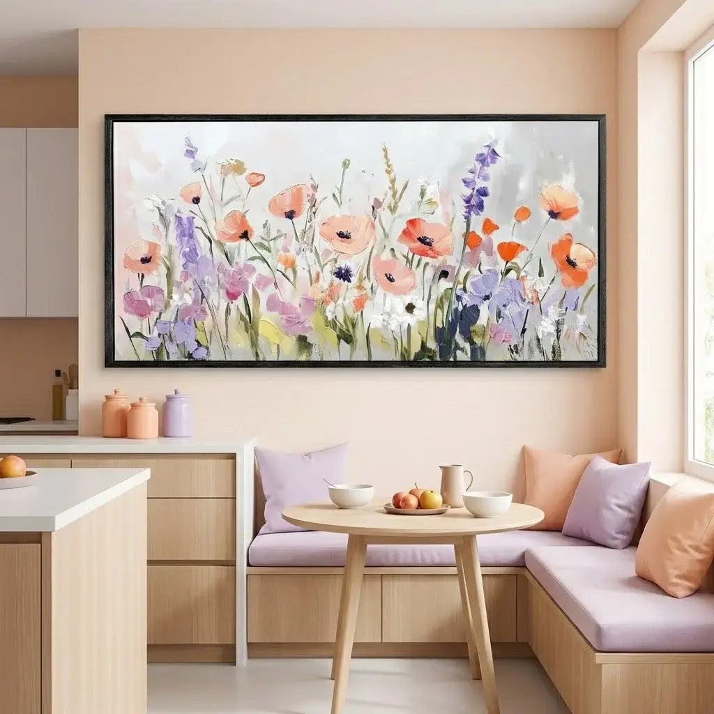 Floral painting on a wall above a kitchen with a table and bench.