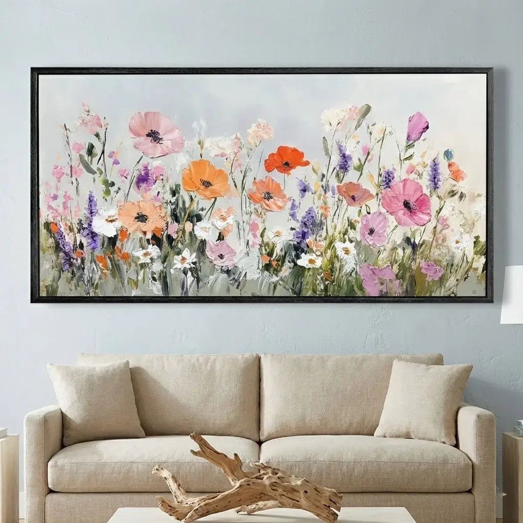 Framed floral painting above a beige sofa in a living room.