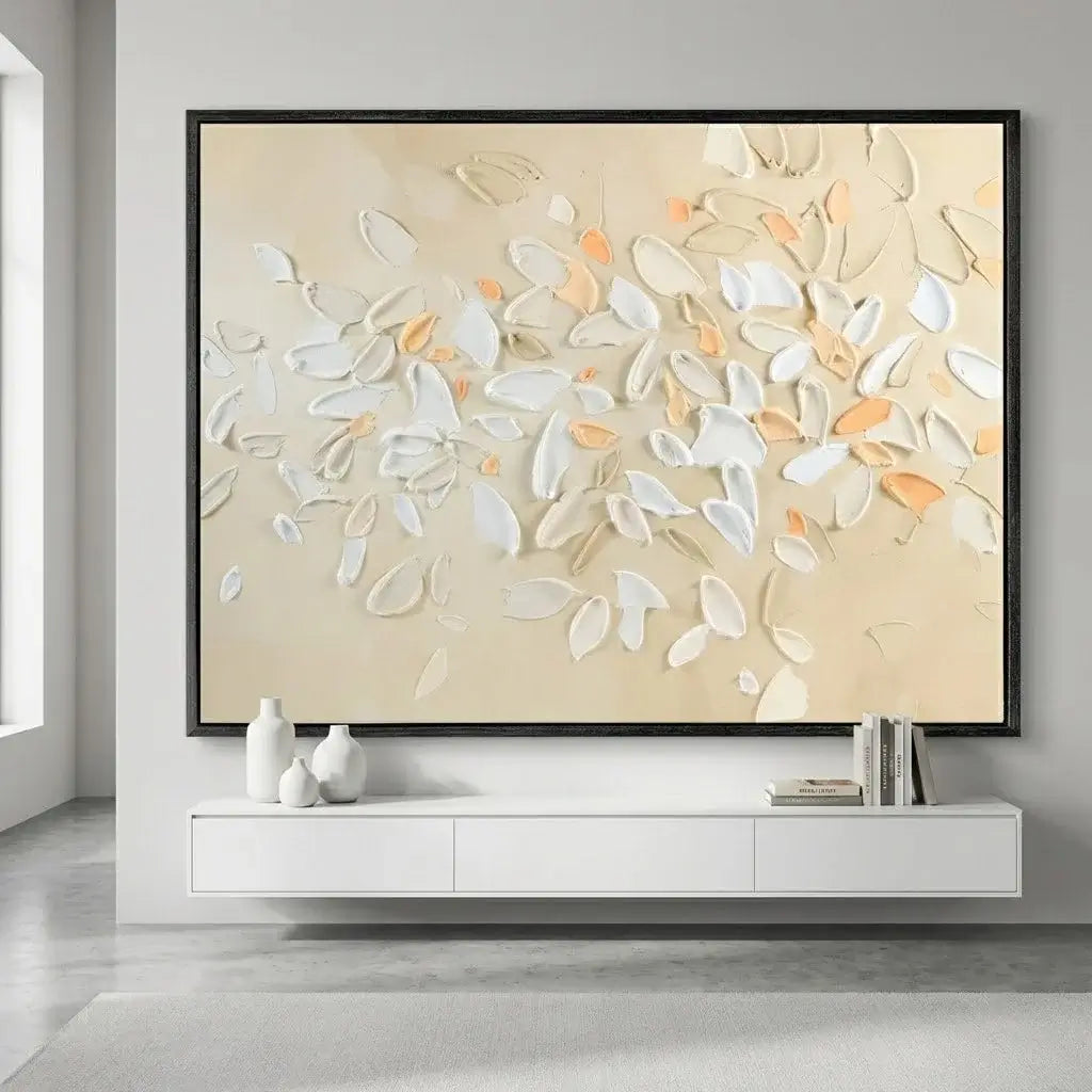 Abstract wall art with white and orange shapes on a beige background in a modern living room.