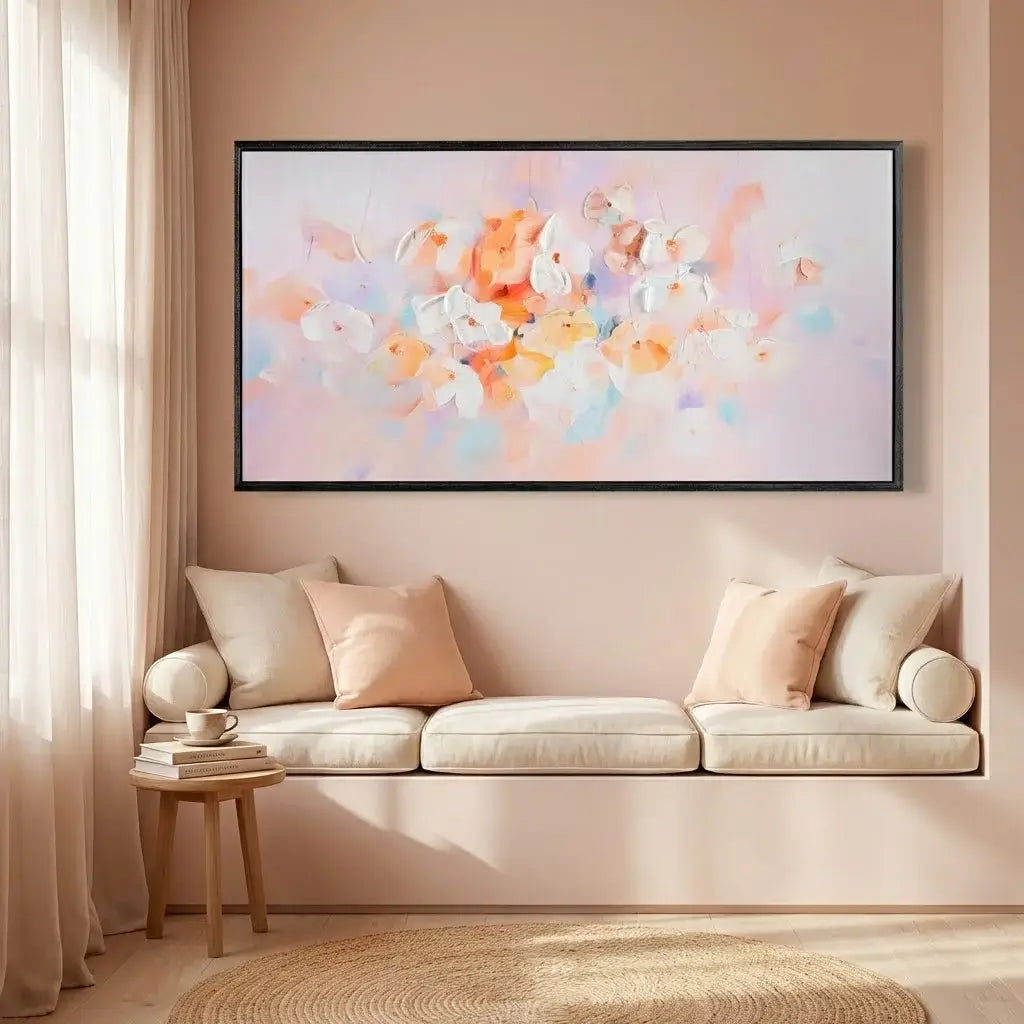 Living room with a beige sofa, small table, and abstract art on the wall.