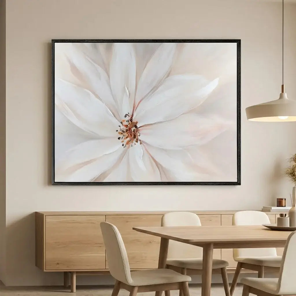 Framed floral artwork above a dining table in a room with neutral decor.