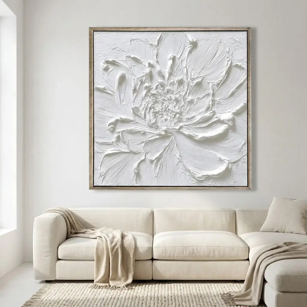 Large framed abstract floral artwork on a wall above a beige sofa.