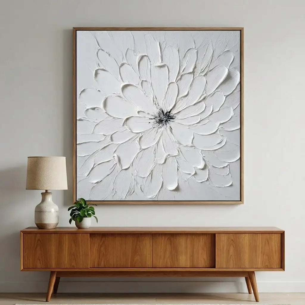 Wooden sideboard with a large framed floral artwork above it in a room setting.