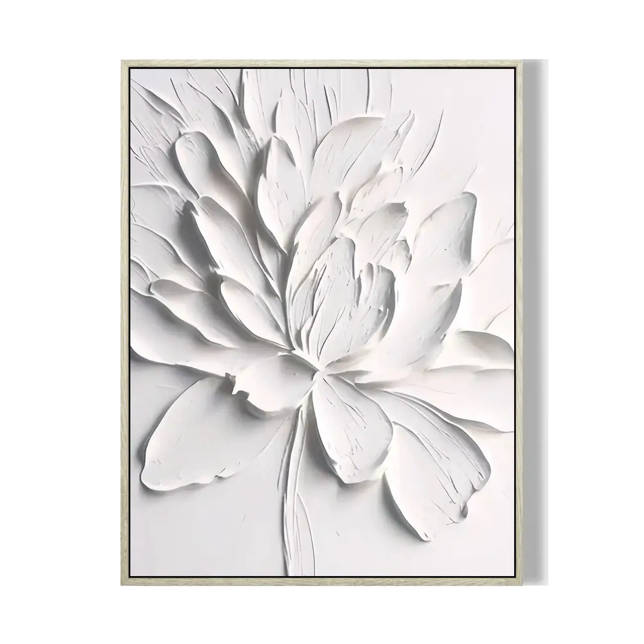 Framed artwork of a white floral design on a white background