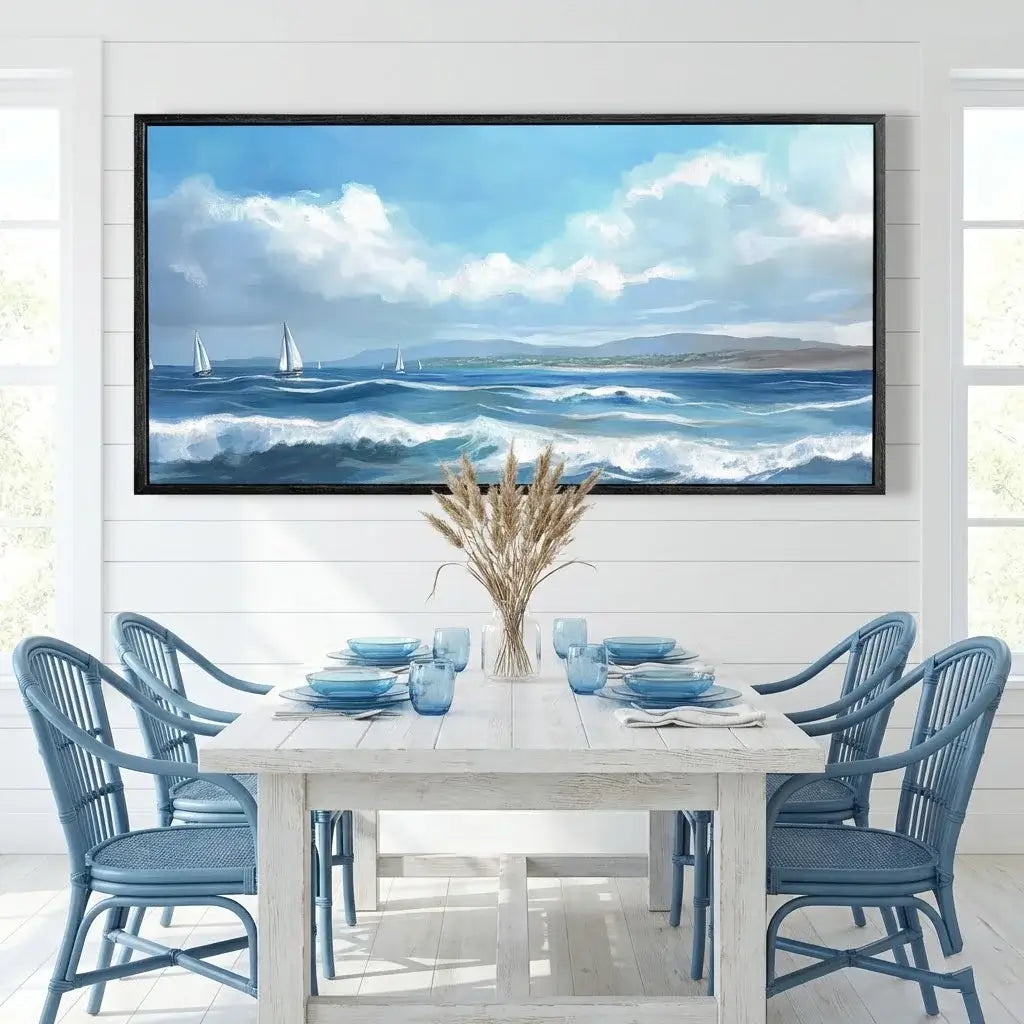 Dining room with a large seascape painting on the wall above a table set for four.
