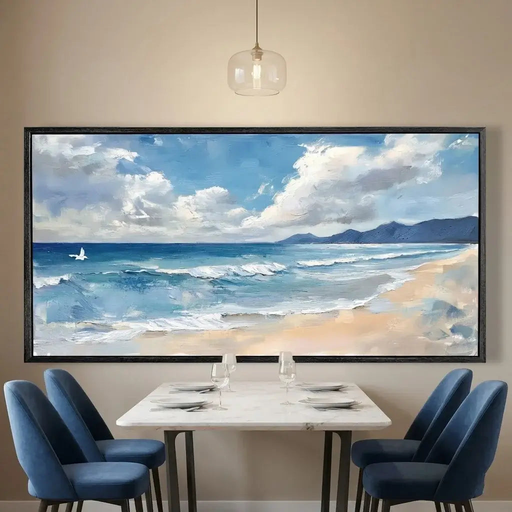 Dining room with a large framed painting of a beach scene on the wall.