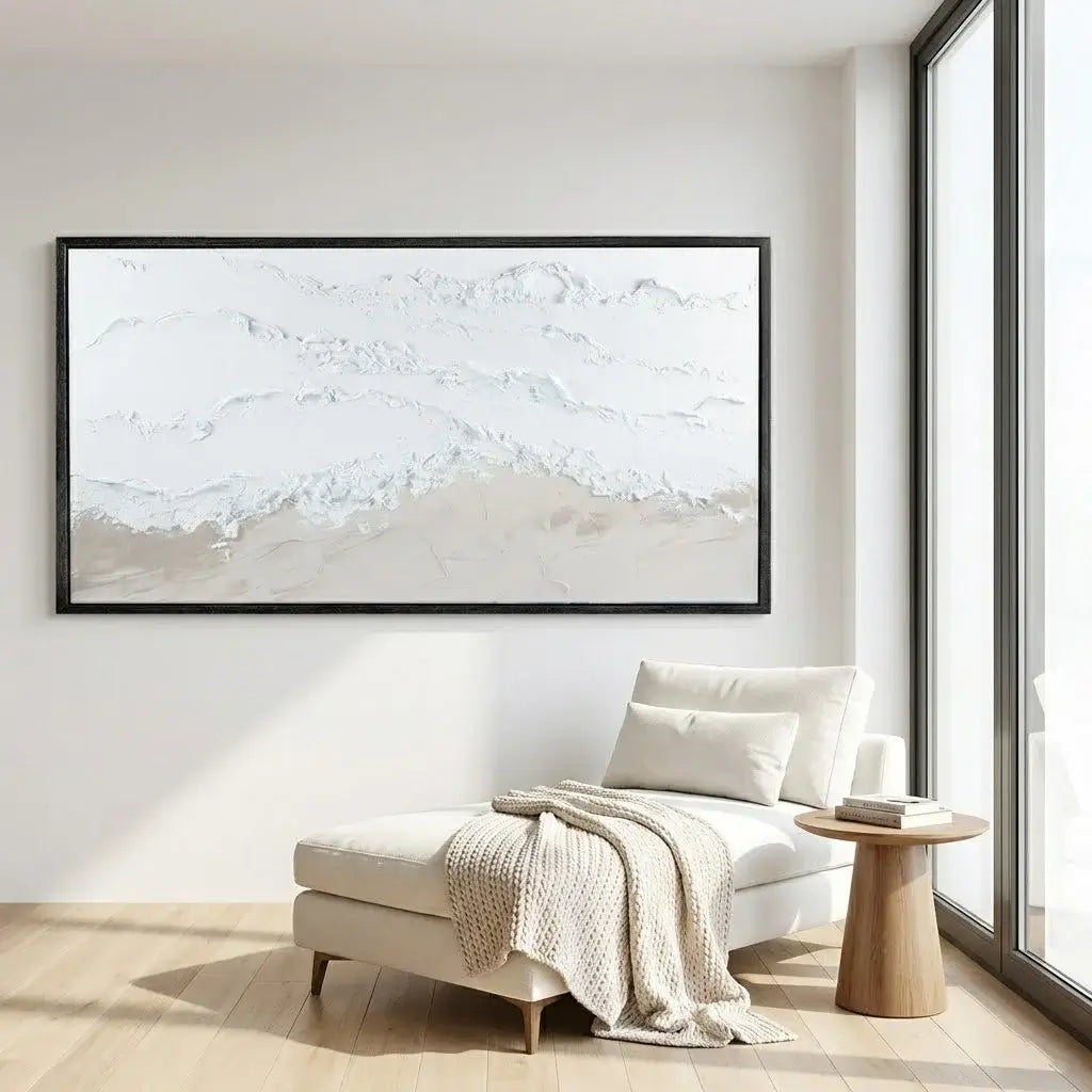 Modern interior with a framed abstract artwork on the wall, a white chair, and a wooden side table.