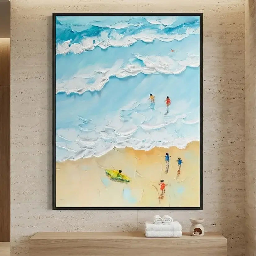 Framed painting of a beach scene with people and a boat on a wall.