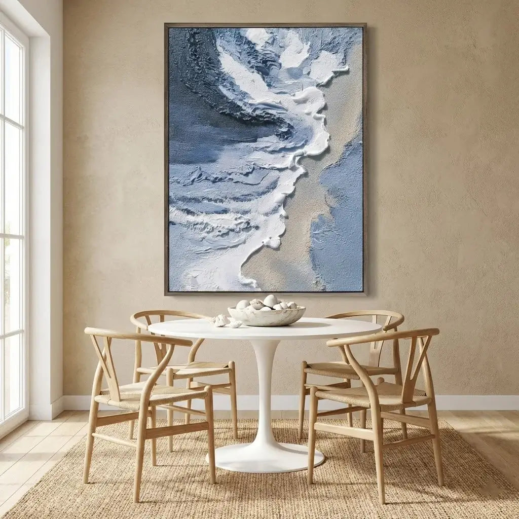 Dining room with a round table and chairs, featuring a large abstract painting on the wall.