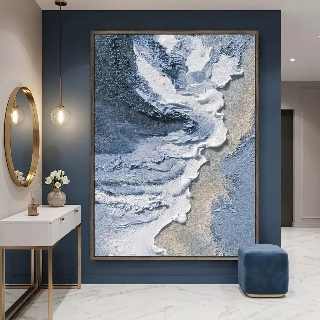 Modern interior with abstract art on a blue wall, round mirror, and small table.