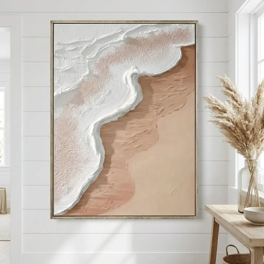 Abstract wall art in a neutral-toned room with a wooden table and decorative elements.