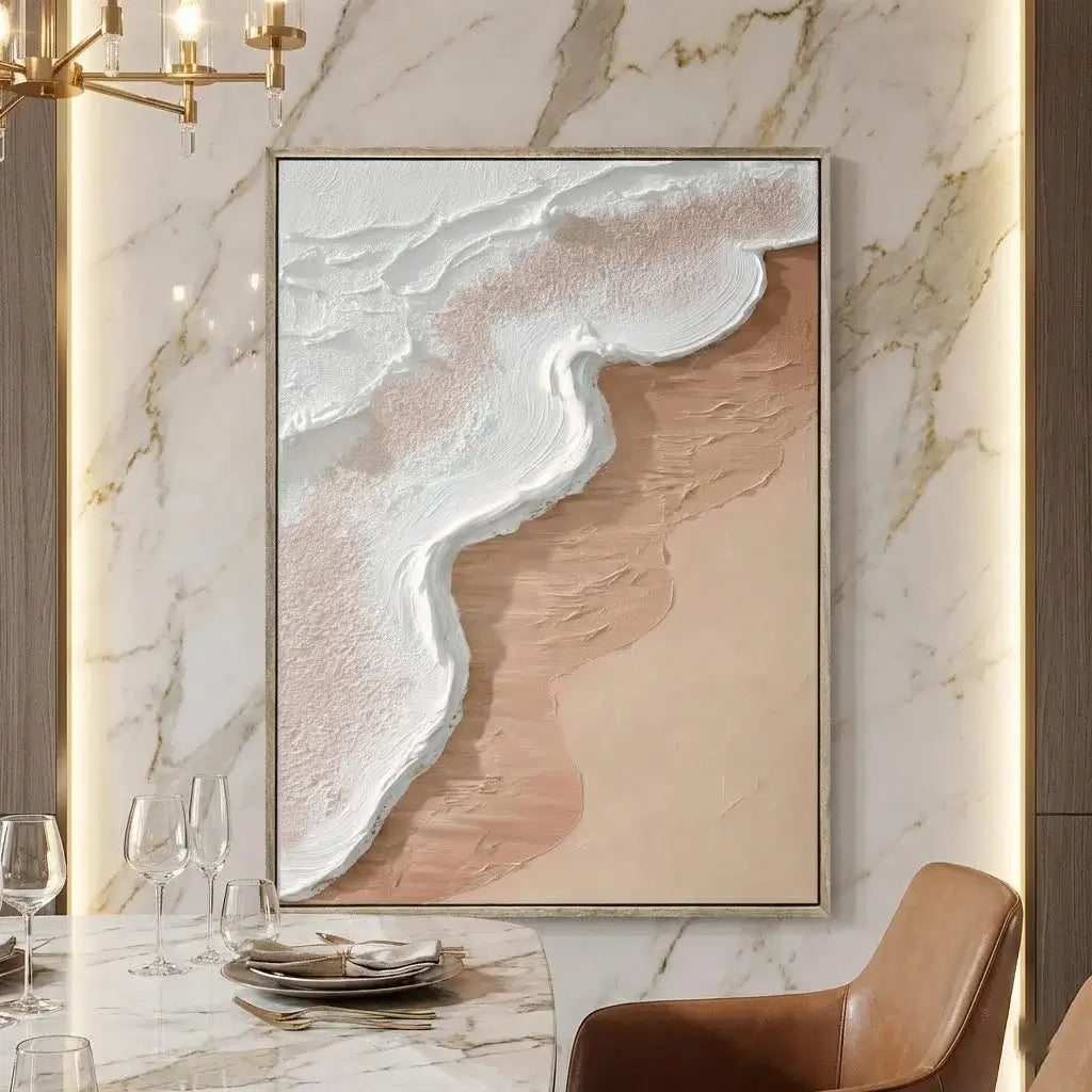 Abstract art piece on a marble wall above a dining table with marble surface and gold chandelier.