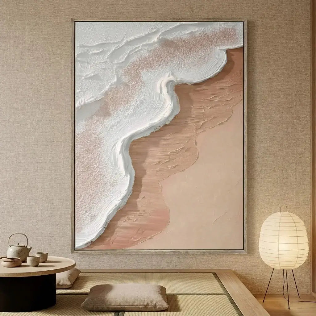 Abstract art piece on a wall in a room with a lamp and small table.