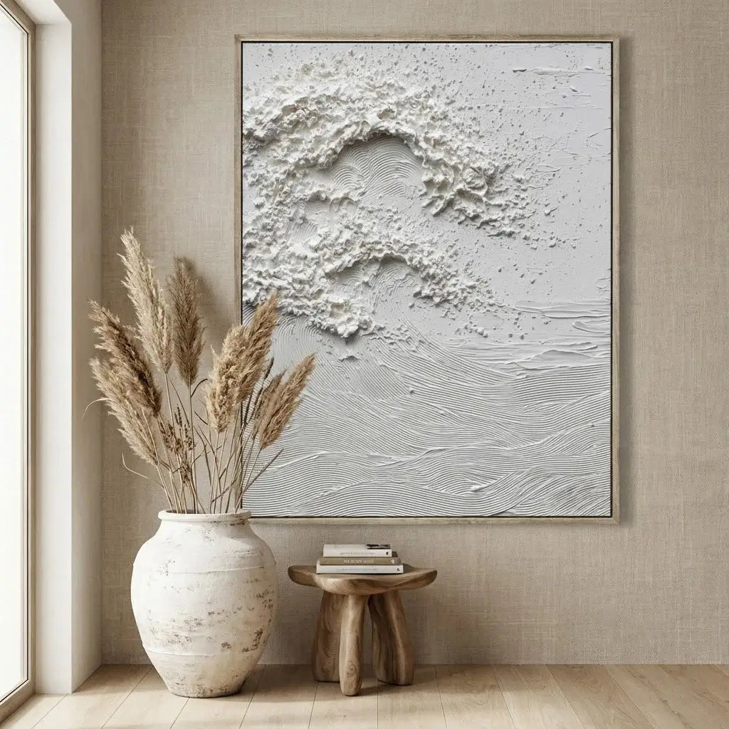 Abstract wall art in a modern interior setting with a vase and books.