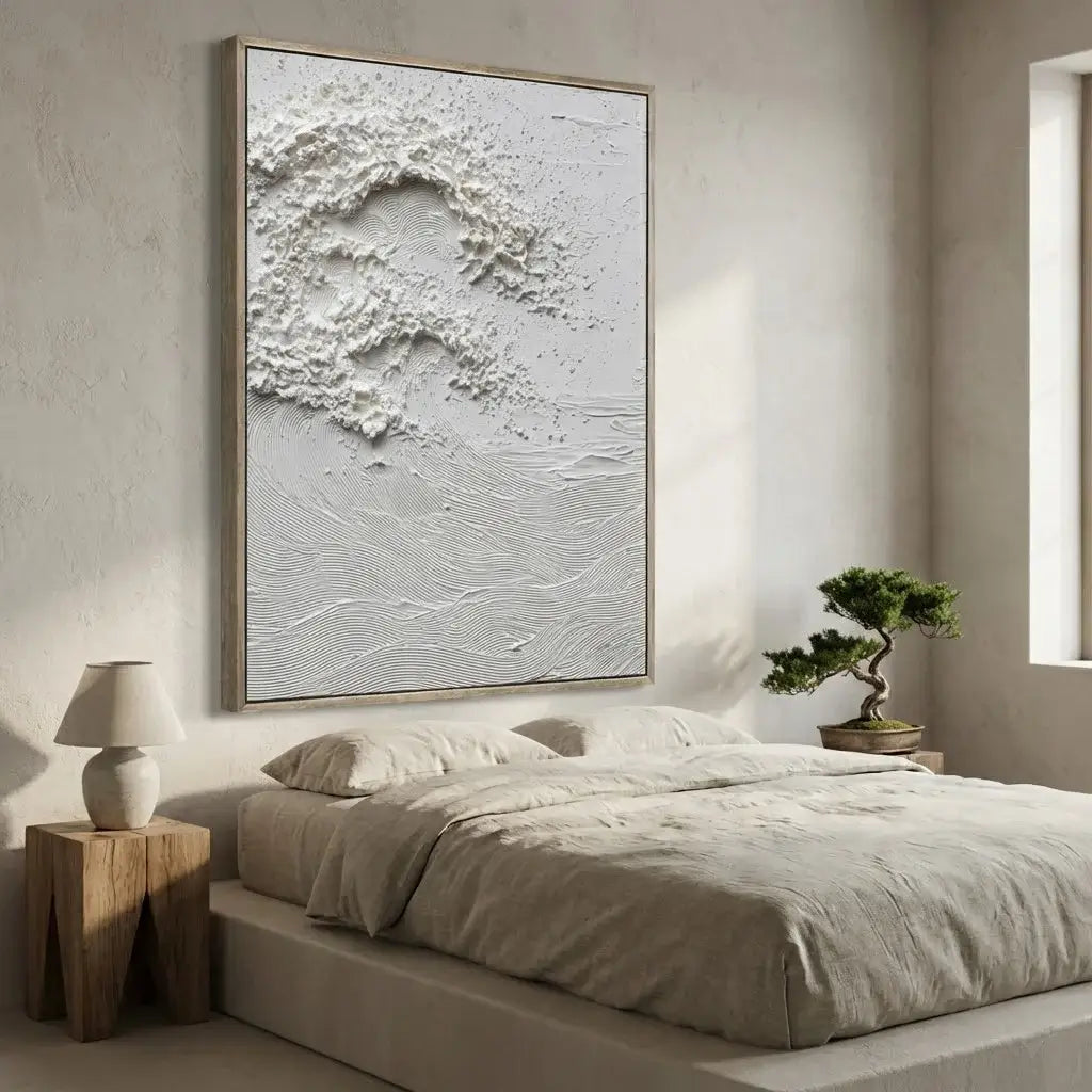 Modern bedroom with abstract wall art, bed, side table, and plant.