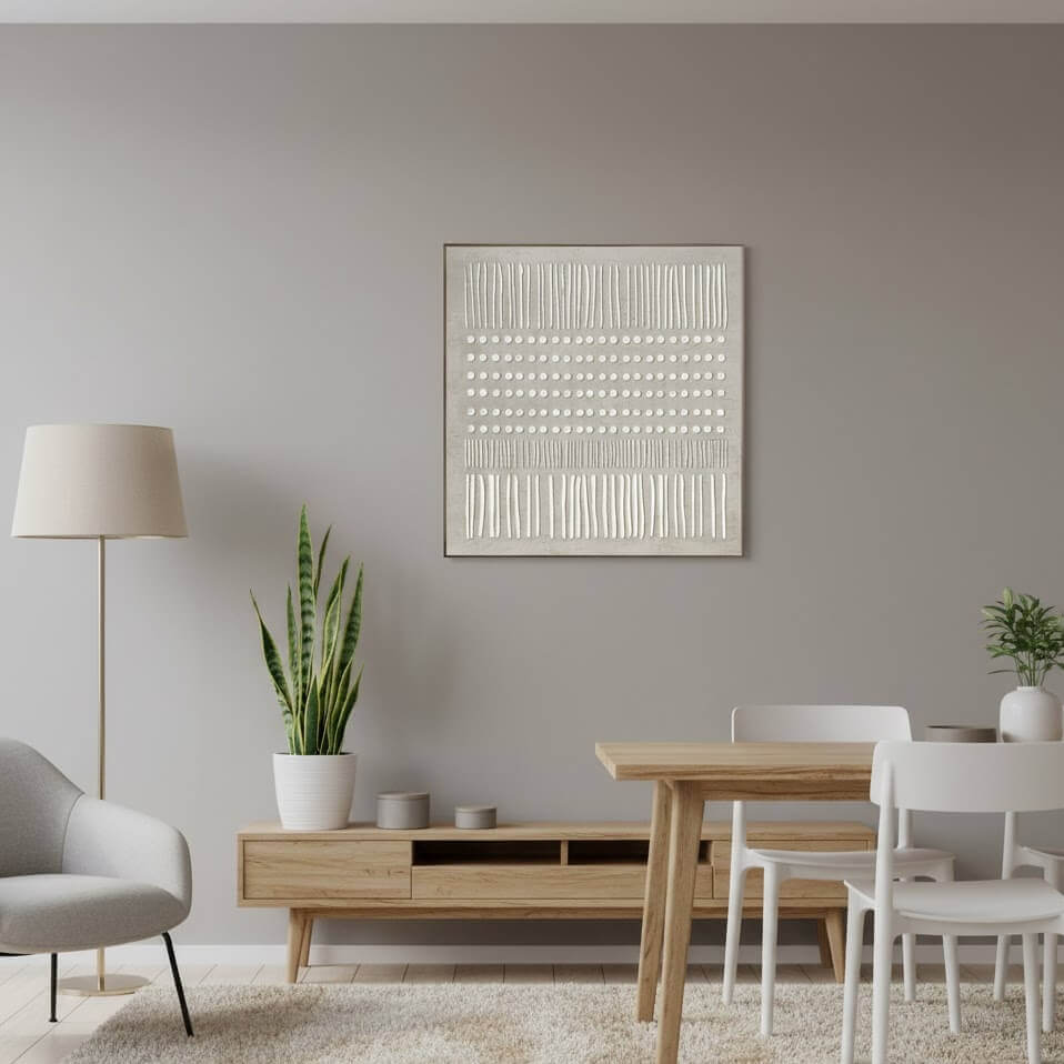 Modern living room with a dining area, abstract art on the wall, and decorative plants.