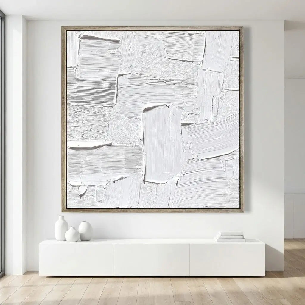 Abstract painting in a modern interior setting with a white wall and wooden floor.