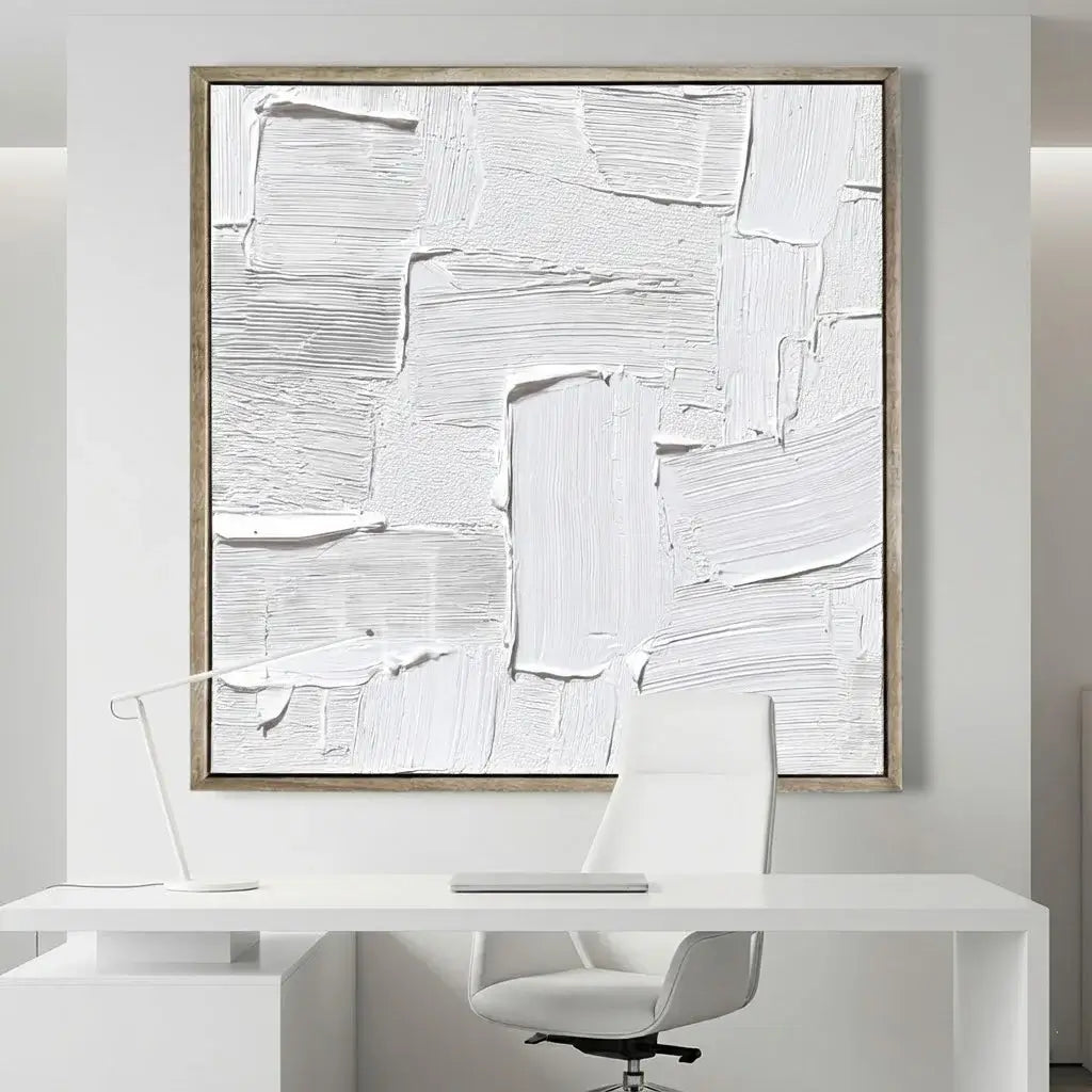 Abstract art piece in a modern office setting with a desk and chair.