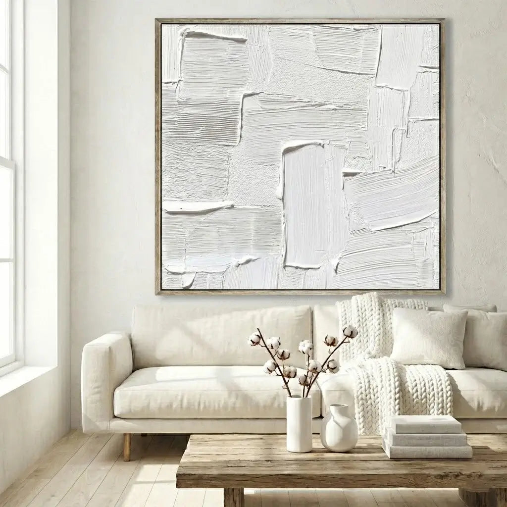 Abstract art piece on a wall above a sofa in a living room.