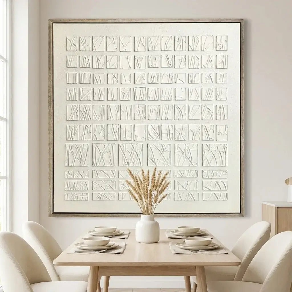 Dining room with a large abstract artwork on the wall, a wooden table with plates and a vase, and white chairs.