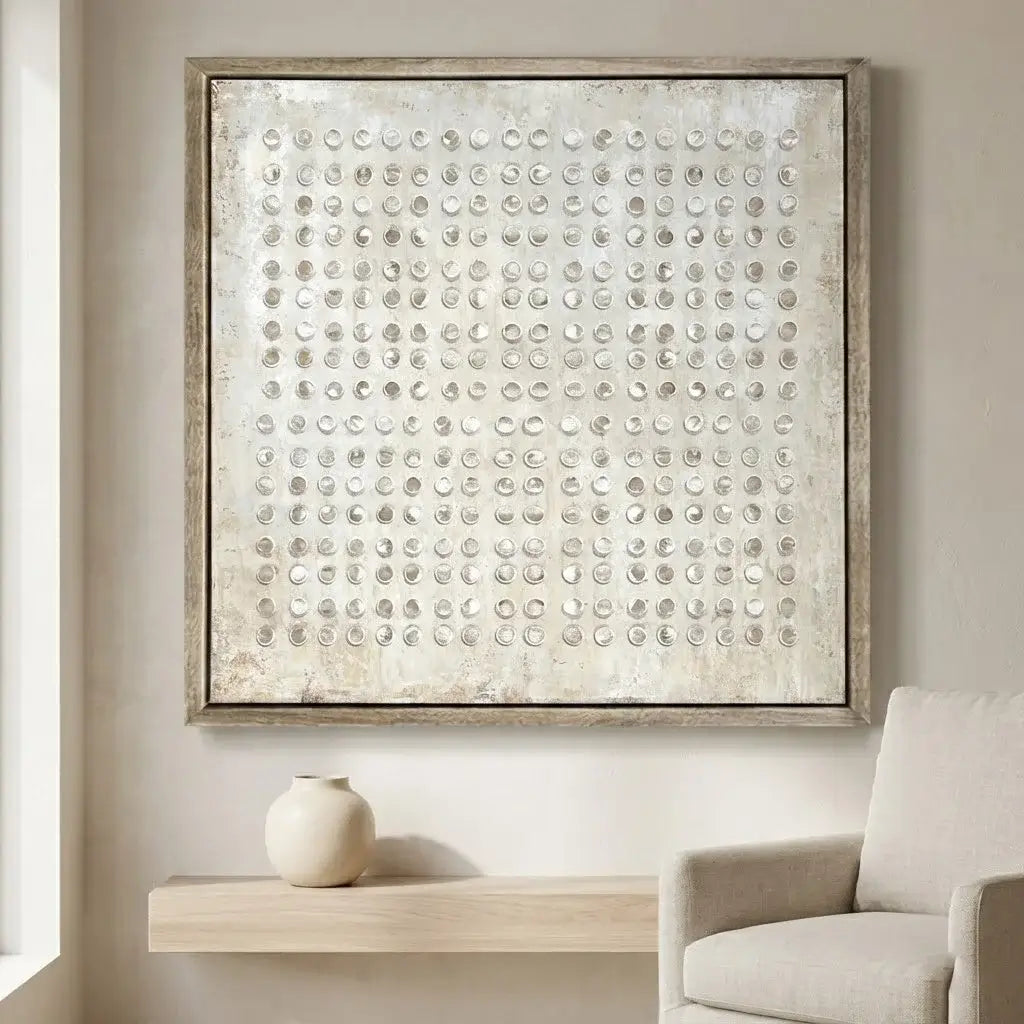 Decorative wall art with circular patterns in a neutral-toned room.