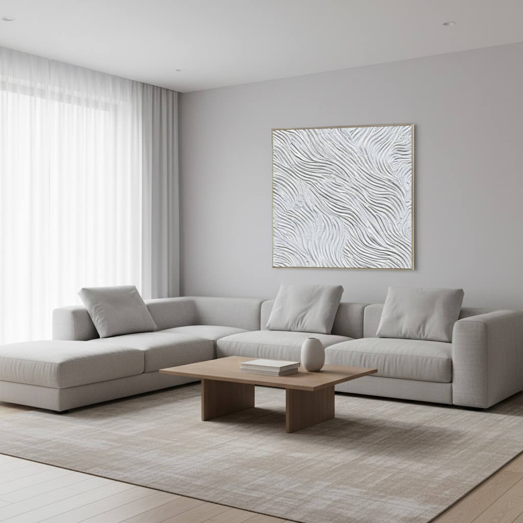 Modern living room with a gray sectional sofa, wooden coffee table, and abstract wall art.