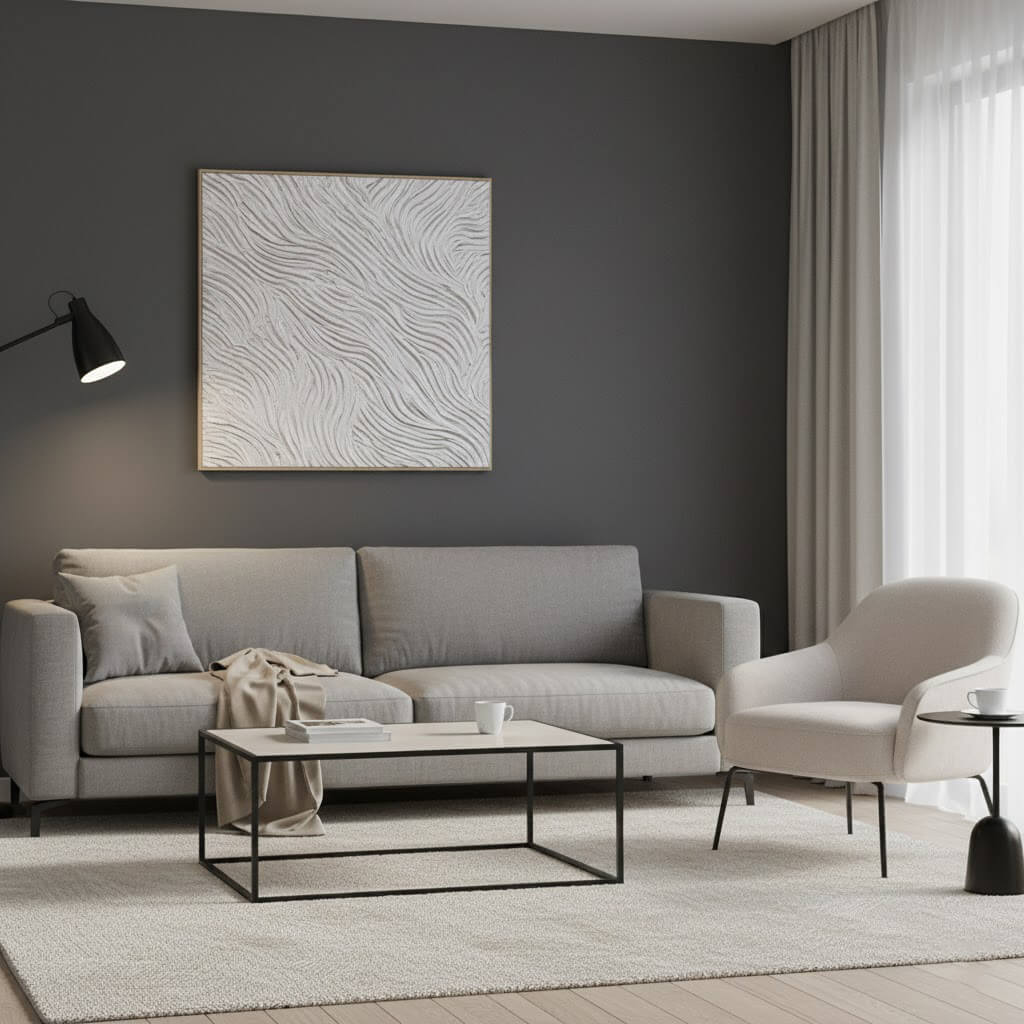 Modern living room with gray sofa, armchair, and coffee table against a dark gray wall.