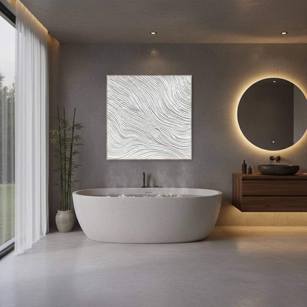 Modern bathroom with a freestanding bathtub, sink, and decorative wall art.