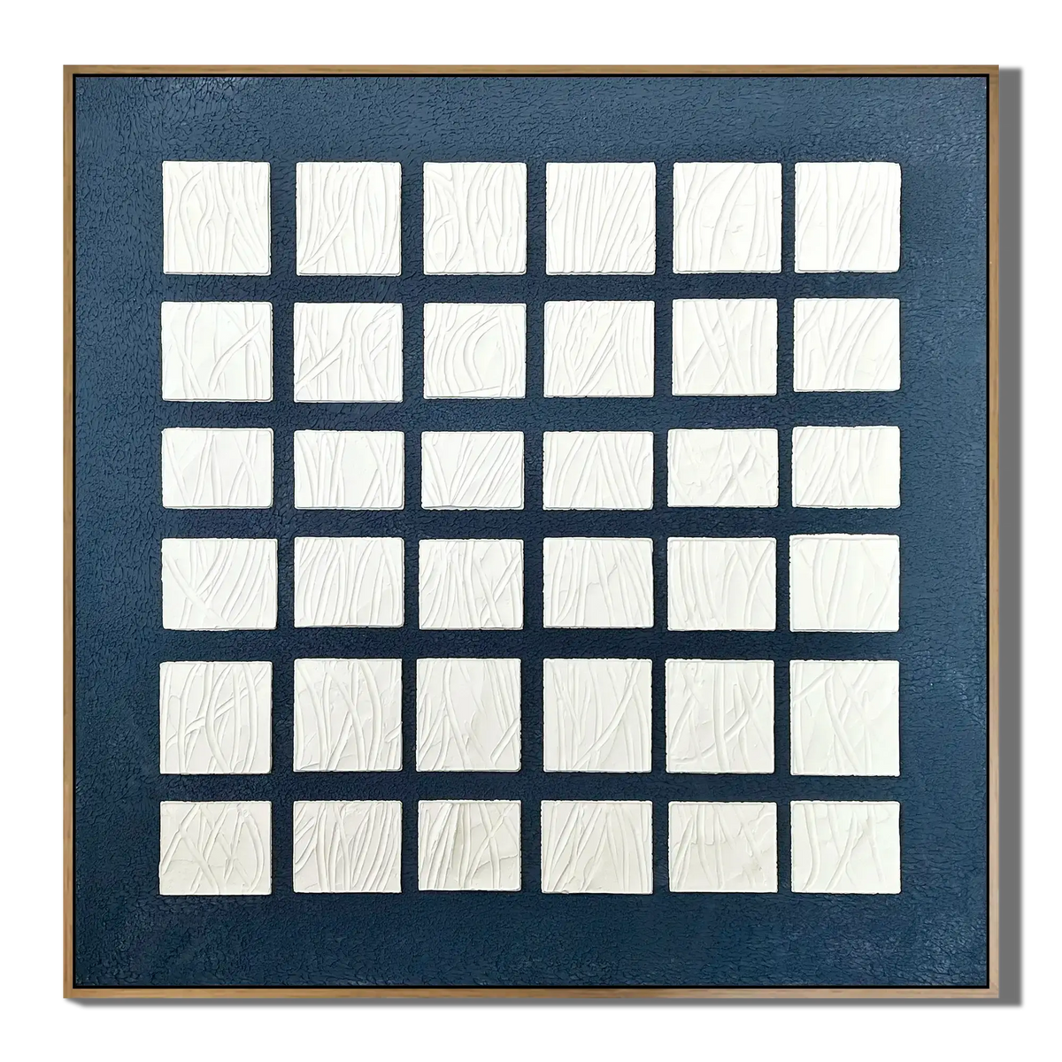Framed artwork with a grid of white squares on a blue background